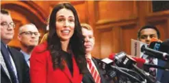  ?? —AFP ?? WELLINGTON: A file photo shows the leader of the New Zealand Labour Party Jacinda Ardern, center, speaking with her front bench at her first press conference at Parliament in Wellington.