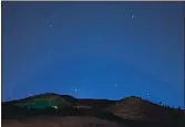  ?? SUSAN TRIPP POLLARD — STAFF ARCHIVES ?? A meteor streaks across the sky as seen from Mitchell Canyon Road near Mount Diablo State Park in Clayton in 2015.