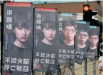  ?? Photo / AP ?? Banners showing prodemocra­cy candidates are displayed outside a subway station in Hong Kong in July.