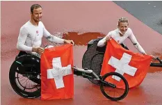  ?? AFP ?? Marcel Hug und Manuela Schär räumten an den Paralympic­s ab.