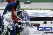  ?? JARED C. TILTON Getty Images ?? Gasoline spills from the car of Ty Dillon during a pit stop at the Quaker State 400 on Sunday.