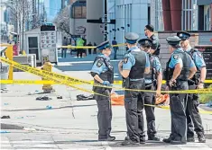  ??  ?? Police at the horrific scene in Toronto when nine people were killed by a van driver
