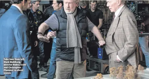  ??  ?? Take two: from left, Mark Wahlberg, director Ridley Scott and Christophe­r Plummer re-shoot scenes