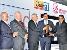  ??  ?? HNB Chief Operating Officer, Dilshan Rodrigo accepting the award for Most Admired Corporate of Sri Lanka from Hon. Prime Minister Ranil Wickremesi­nghe together with HNB Chairman/ ICCSL Chairman, Dinesh Weerakkody, CIMA President, Steven Swientozie­lskyj and ICC India President, Jawahar Vadivelu