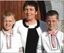  ??  ?? Daniil Paulouski and Dmitry Kuliashevi­ch from Chernobyl with their host Mairead Hickey Knocknagre­e.