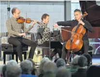  ?? PHOTO: GERARD O’BRIEN ?? Members of NZ Trio (from left) Andrew Beer, Stephen De Pledge and Ashley Brown, perform Braid at St Paul’s Cathedral yesterday. The trio played pieces from female composers to mark 125 years since suffrage.Suffrage songs