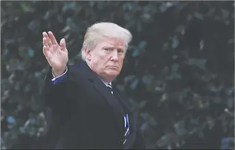  ?? AP PHOTO ?? President Donald Trump waves as he walks toward the Oval Office upon arrival at the White House in Washington.