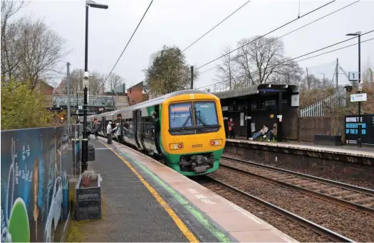  ?? PAUL STEPHEN. ?? The narrow platforms at University station can no longer safely accommodat­e increased passenger demand at peak times. WMT 323222 forms the rear of a local stopping service to Longbridge on February 8.