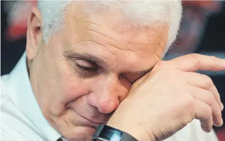  ?? DARRYL DYCK, THE CANADIAN PRESS ?? Retiring Lions head coach Wally Buono pauses to compose himself during Tuesday’s emotional news conference as players gathered to clean out their lockers at the team's practice facility in Surrey.