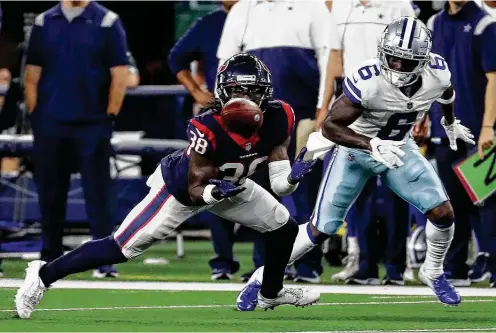  ?? Photos by Brett Coomer / Staff photograph­er ?? Texans safety Shyheim Carter (38) didn’t start, but he recorded one of his team’s three intercepti­ons in a 20-14 preseason win over the Cowboys.