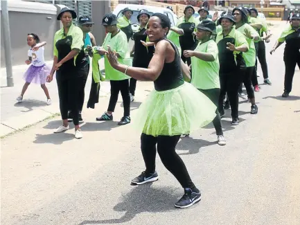  ?? / KABELO MOKOENA ?? Cathrine Mathebe, 62, front, of Tembisa, who spent time on crutches due to ill-health, has started a dancing project to help other people regain their fitness through exercise.