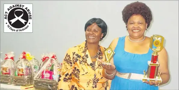  ?? Picture: SIKHO NTSHOBANE ?? CHAMPION: Ngqeleni police station member Lieutenant Colonel Saphokazi Dyala, right, is congratula­ted by Mthatha cluster Women’s Network champion Colonel Bongiwe Fikela after scooping the best women’s network support champion title at a function in...