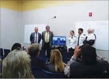  ?? RECORDER PHOTO BY JAMIE HUNT ?? Portervill­e Military Academy Principal Doug Imhels (left) is joined by two cadets and the creators of the STEMPILOT flight simulator during a demonstrat­ion Monday, Feb. 11 at PMA.