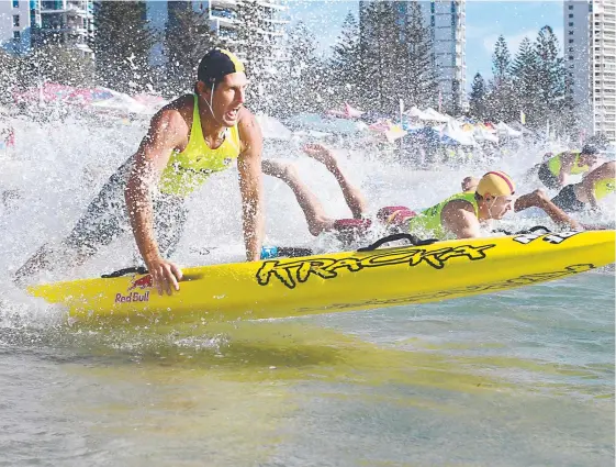  ?? Picture: HARVPIX ?? Bondi Rescue star Anthony Carroll hits the water in a board event at the Aussies.