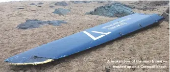  ??  ?? A broken bow of the maxi trimaran washed up on a Cornwall beach