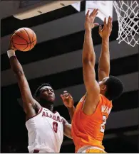  ?? AP/BRYNN ANDERSON ?? Alabama forward Donta Hall shoots over Tennessee forward Grant Williams during the Crimson Tide’s 78-50 victory over the No. 15 Volunteers on Saturday in Tuscaloosa, Ala. Hall had 17 points and 11 rebounds for the Crimson Tide.