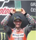  ??  ?? Victory celebratio­n: Andreas Dovizioso on podium at Brno