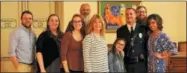  ?? CHARLES PRITCHARD - ONEIDA DAILY DISPATCH ?? Police Officer Matt Gacek, in uniform, stands with his family after winning Oneida Police Officer of the Year at the Charlie Decker Public Safety Dinner on Friday, May 11, 2018.