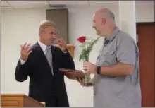  ?? CHARLES PRITCHARD - ONEIDA DAILY DISPATCH ?? Jeff Leahey, right, accepts the Roses to the Living award from Oneida Rotarian Craig Hatch on Tuesday, June 18, 2019.