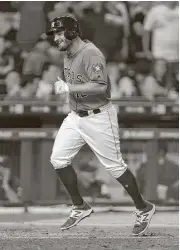  ?? Karen Warren / Houston Chronicle ?? The Astros’ Tyler White smiles as he crosses home plate after hitting his second home run. White started at first base and was 4-for-5 with a double.