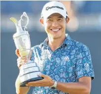  ?? REUTERS • PAUL CHILDS ?? Collin Morikawa of the U.S. celebrates with the Claret Jug after winning The Open Championsh­ip At Royal St George’s in Sandwich, Britain, on Sunday.