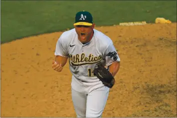  ?? JOSE CARLOS FAJARDO — BAY AREA NEWS GROUP ?? The A’s Liam Hendriks celebrates after striking out the White Sox’s Nomar Mazara for the final out in Game 3 of an American League wild-card series Thursday in Oakland.