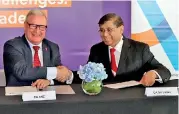  ??  ?? CA Sri Lanka President Jagath Perera and CA ANZ Chief Executive Officer Rick Ellis congratula­te each other soon after signing the landmark agreement in Sydney, Australia