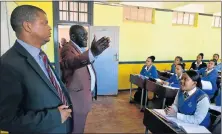  ?? Picture: EUGENE COETZEE ?? SCHOOLS PROBE: Uitenhage High School principal Mark Williams, left, with education portfolio committee chairman Fundile Gade in a classroom at the school