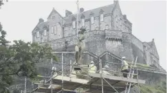  ??  ?? The fountain is lifted from its plinth ready for renovation