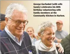  ??  ?? George Garfunkel (with wife Sandy) celebrates his 80th birthday volunteeri­ng with family members at the Community Kitchen in Harlem.