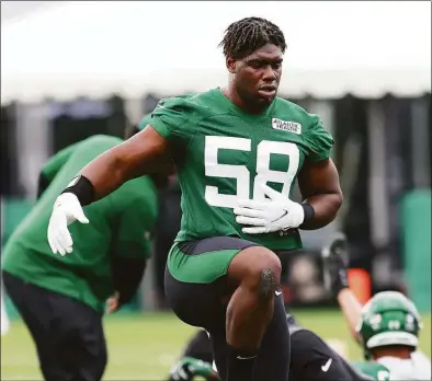  ?? Rich Schultz / Getty Images ?? Jets DE Carl Lawson works out during training camp last year.