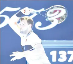  ??  ?? Bulgaria’s Grigor Dimitrov hits a return against Serbia’s Janko Tipsarevic during their men’s singles match on day one of the Australian Open tennis tournament in Melbourne on January 14, 2019. - AFP photo