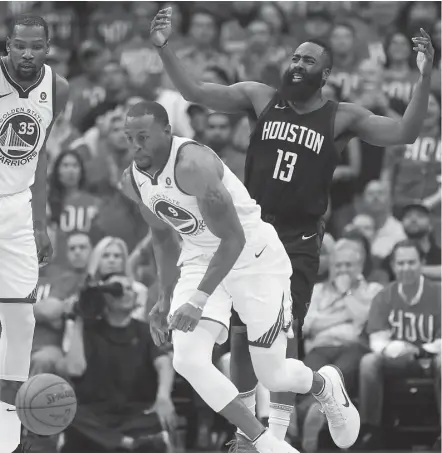  ?? Brett Coomer / Houston Chronicle ?? Rockets guard James Harden, right, looks on in disgust as Warriors forward Andre Iguodala, center, forces a second-half turnover.