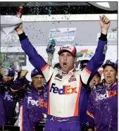  ?? AP/JOHN RAOUX ?? Denny Hamlin celebrates in Victory Lane after winning the Daytona 500 for the second time in four years.