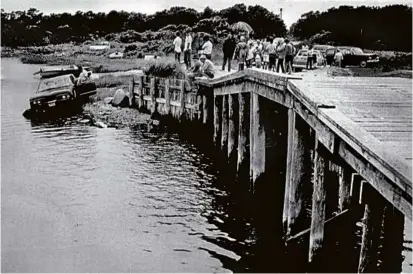  ?? GLOBE FILE PHOTO/1069 ?? Senator Edward M. Kennedy’s car after it crashed on Chappaquid­dick in 1969, killing Mary Jo Kopechne.