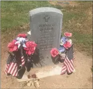  ?? RECORDER PHOTO BY CHARLES WHISNAND ?? People were already placing memorials on Friday at the grave sites of their loved ones who served in the military.