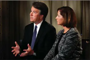  ?? AP/JACQUELYN MARTIN ?? Brett Kavanaugh, with his wife Ashley Estes Kavanaugh, answers questions during a Fox News interview on Monday in Washington about allegation­s of sexual misconduct against the Supreme Court nominee.