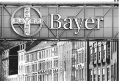  ??  ?? The logo of Bayer AG is pictured at the Bayer Healthcare subgroup production plant in Wuppertal, Germany. The European Commission has started an in-depth investigat­ion of Bayer’s planned US$66 billion takeover of US seeds group Monsanto, saying it was...