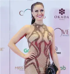  ?? NOEL CELISNOEL CELIS/AFP/GETTY IMAGES ?? Miss Canada Siera Bearchell arrives at the Miss Universe after-party red carpet event at a hotel in Manila on January 30, 2017.