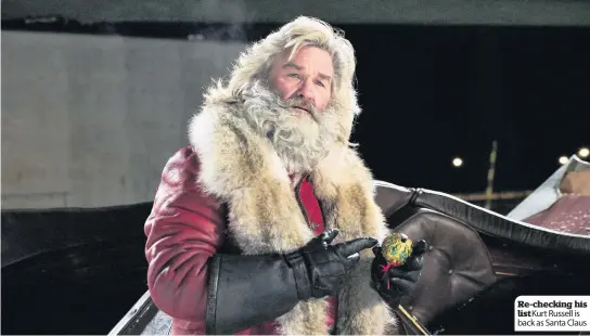  ??  ?? Re-checking his list Kurt Russell is back as Santa Claus