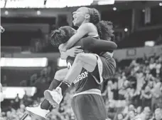  ?? MARK D. SMITH, USA TODAY SPORTS ?? Mississipp­i State’s Breanna Richardson, left, and Morgan William celebrate Sunday after beating Baylor in the Elite Eight.