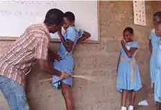  ??  ?? Corporal punishment has been banned in Zimbabwe, but others want it back to make students more discipline­d.