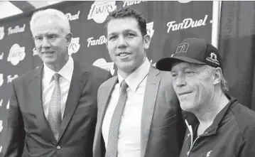  ?? Luis Sinco Los Angeles Times ?? FIRST-YEAR HEAD COACH Luke Walton, center, survived Tuesday’s Lakers purge, as expected, but longtime general manager Mitch Kupchak, left, was fired, and Jim Buss had his role reduced to owner.