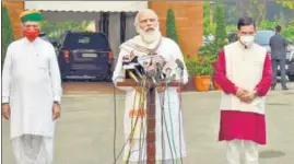  ?? PIB ?? PM Narendra Modi addresses the media ahead of the monsoon session in the presence of Union ministers Pralhad Joshi and Arjun Ram Meghwal on Monday.