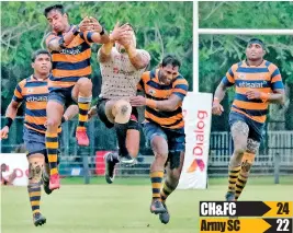  ??  ?? A tussle for the ball between CH and Army players - Pix by Amila Gamage