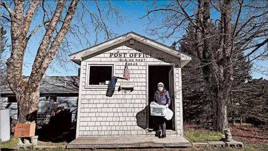  ?? ROBERT F. BUKATY/AP ?? The post office on Isle au Haut, Maine, serves only about 70 people, but with no bridge to the mainland plus spotty cellphone and Wi-Fi reception on the island, it is vital to residents.