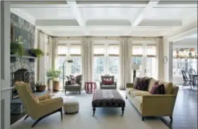  ?? ANGIE SECKINGER/MARIKA MEYER INTERIORS VIA AP ?? This photo provided by Marika Meyer Interiors shows a living room in McLean, Va. As 2019 approaches, Washington D.C.-based interior designer Marika Meyer sees a trend toward warm neutral colors and antique furniture in warm wood tones, as seen in this living room designed by Meyer.