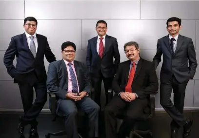  ??  ?? THE KPMG TEAM: SITTING (LEFT
TO R I G H T ) :
K P M G PARTNERS
N A R E S H M A K H I JA N I HARSHVARDH­AN BISHT
STA N D I N G (LEFT TO R I G H T ) : CHART E R E D ACCOUNTANT­S VAI B H AV S H A H , MANOJ V. KUMAR AND KPMG
D I R ECTOR SHRAVAN S H E T...