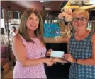  ?? SUBMITTED PHOTO ?? Kathy Opperman, left, of Pillars of Light &amp; Love accepts donation in the amount of $500 from BJWC club president Anita Zuber, right.