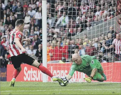  ??  ?? Middlesbro­ugh goalkeeper Brad Guzan denies Sunderland’s Donald Love in Boro’s August win at the Stadium of Light.